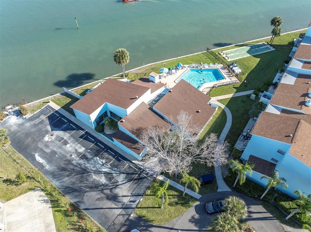 1 Windrush Boulevard, Unit 87 Indian Rocks Beach, FL 33785 - Photo 42 of 54 a view of a swimming pool with chairs