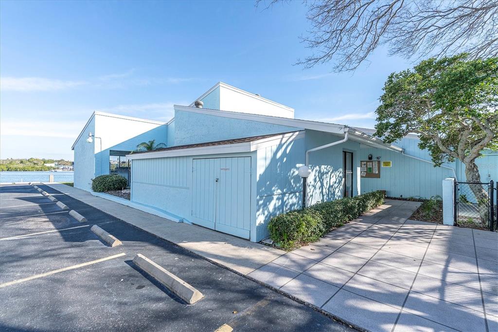 1 Windrush Boulevard, Unit 87 Indian Rocks Beach, FL 33785 - Photo 43 of 54 a front view of a house with garden