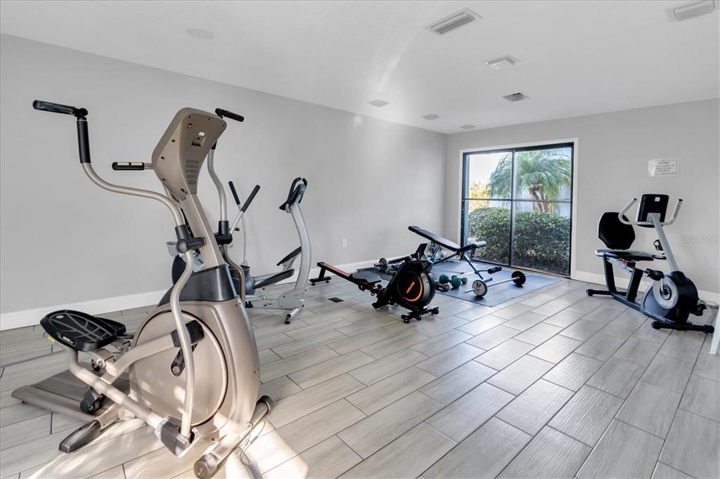 1 Windrush Boulevard, Unit 87 Indian Rocks Beach, FL 33785 - Photo 48 of 54 a view of a room with gym equipment