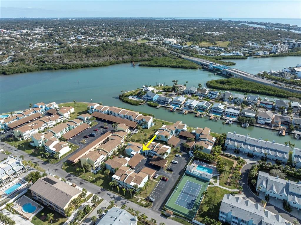 1 Windrush Boulevard, Unit 87 Indian Rocks Beach, FL 33785 - Photo 54 of 54 an aerial view of a city with a lake view