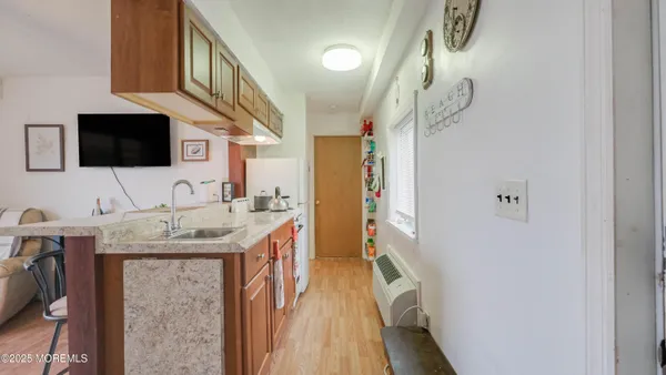 a spacious bathroom with a granite countertop sink a mirror and vanity