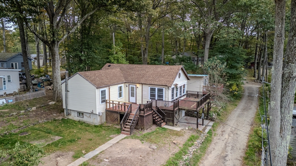 4 Stevens Way Rutland, MA 01543 - Photo 4 of 42 an aerial view of a house with backyard porch and sitting area