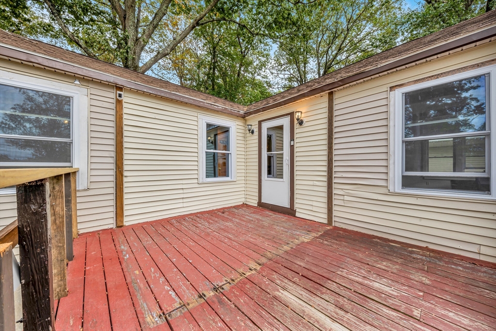 4 Stevens Way Rutland, MA 01543 - Photo 8 of 42 a view of backyard with a deck and wooden floor
