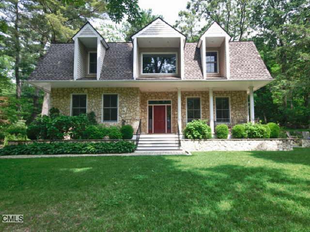 34 Fairmead Road Darien, CT 06820 - Photo 1 of 1 a front view of a house with a yard and trees