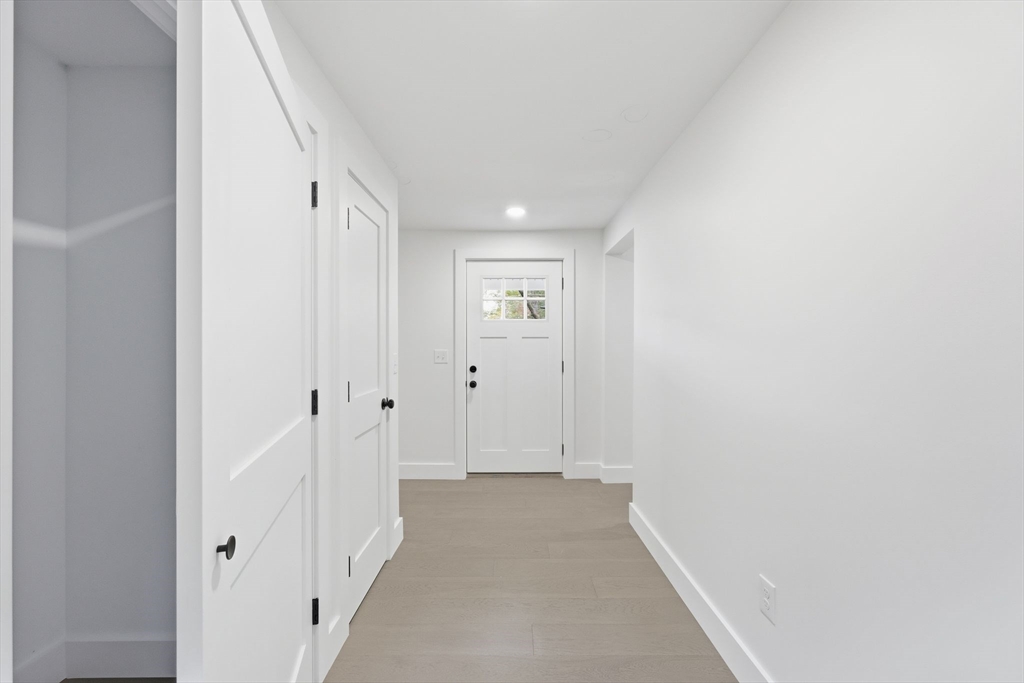 75 Lead Mine Road Southampton, MA 01073 - Photo 20 of 42 a view of a hallway with wooden floor and entryway