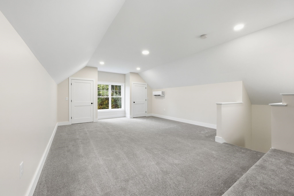 75 Lead Mine Road Southampton, MA 01073 - Photo 24 of 42 a view of a big room with windows and chandelier fan