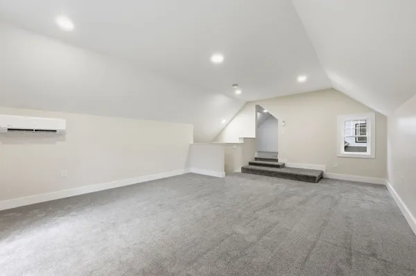an empty room with staircase