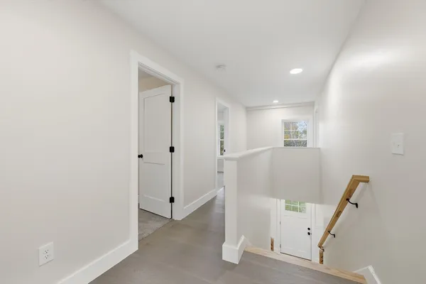 a view of entryway with window and wooden floor
