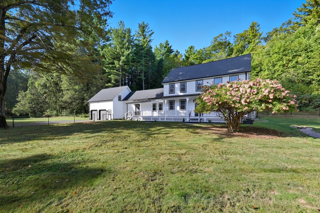 75 Lead Mine Road Southampton, MA 01073 - Photo 4 of 42 a front view of a house with a yard