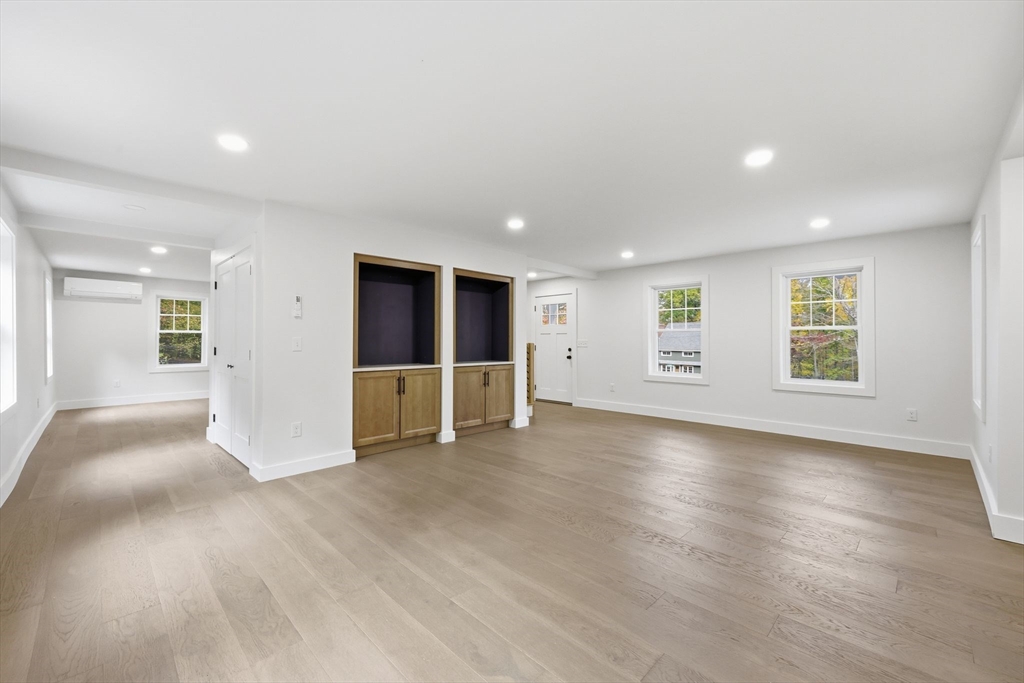 75 Lead Mine Road Southampton, MA 01073 - Photo 7 of 42 a view of an empty room with a window and wooden floor
