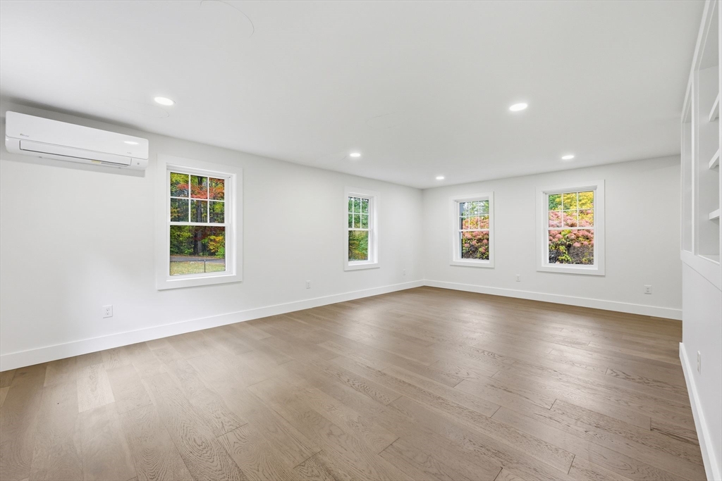 75 Lead Mine Road Southampton, MA 01073 - Photo 8 of 42 an empty room with wooden floor and windows