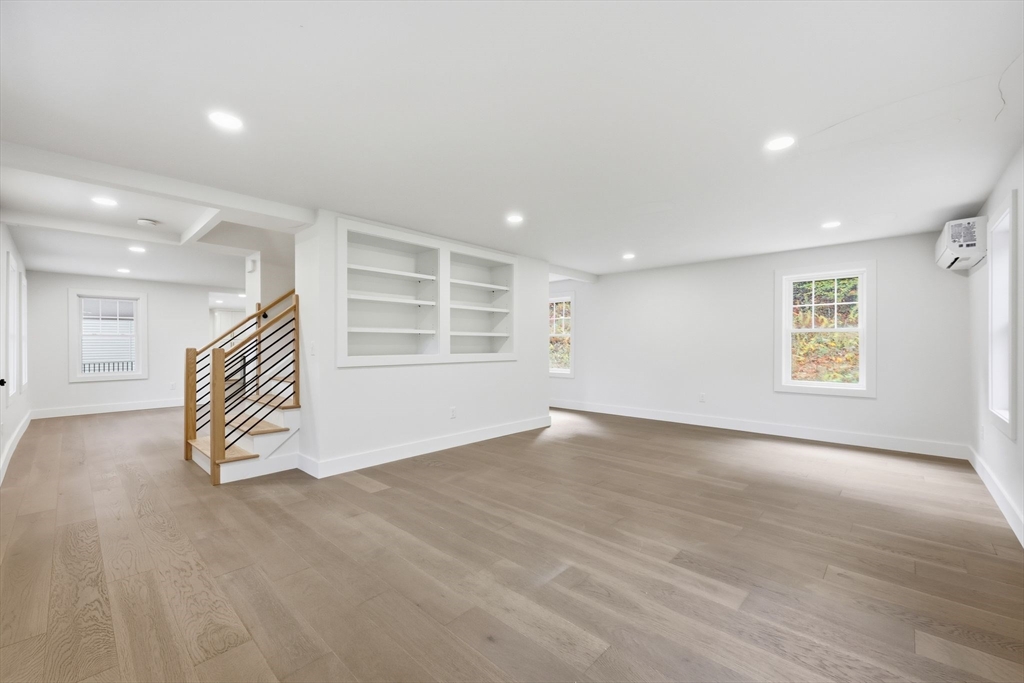 75 Lead Mine Road Southampton, MA 01073 - Photo 10 of 42 an empty room with wooden floor and windows