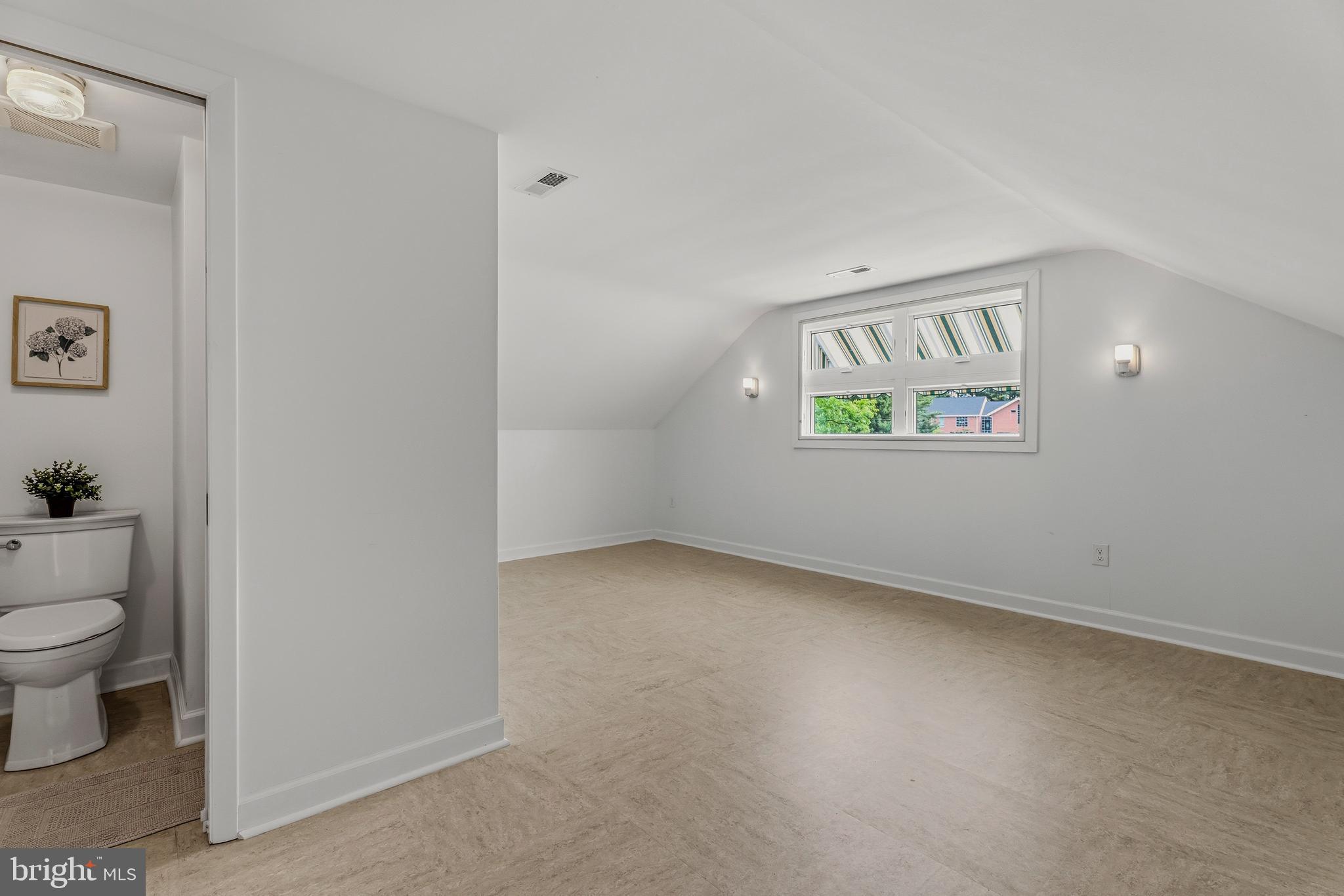 2425 Albert Rill Road Hampstead, MD 21074 - Photo 31 of 44 a view of an empty room with a window and wooden floor