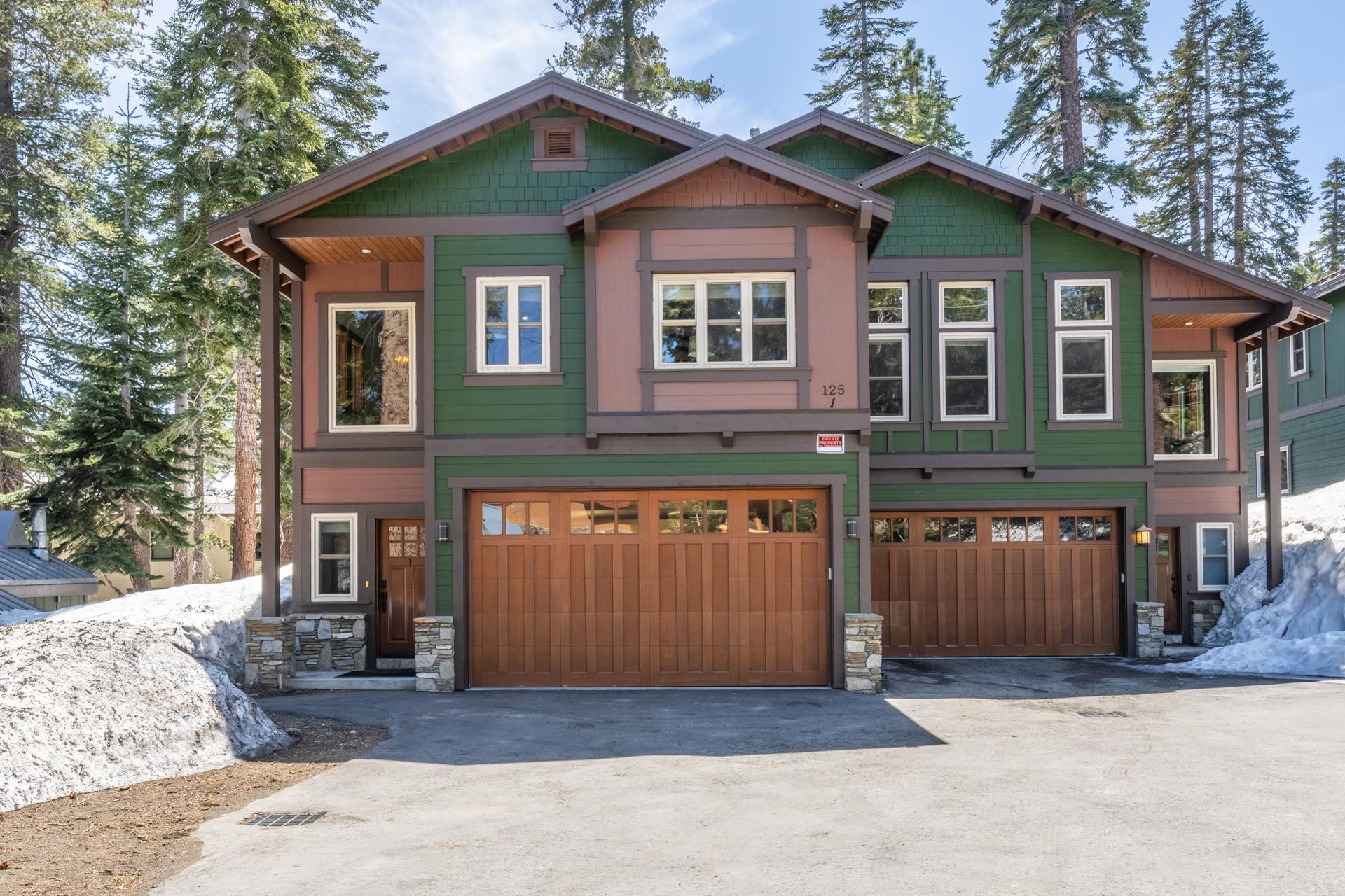 125 Davison Road, Unit 1 Mammoth Lakes, CA 93546 - Photo 5 of 46 a front view of a house with a yard and garage