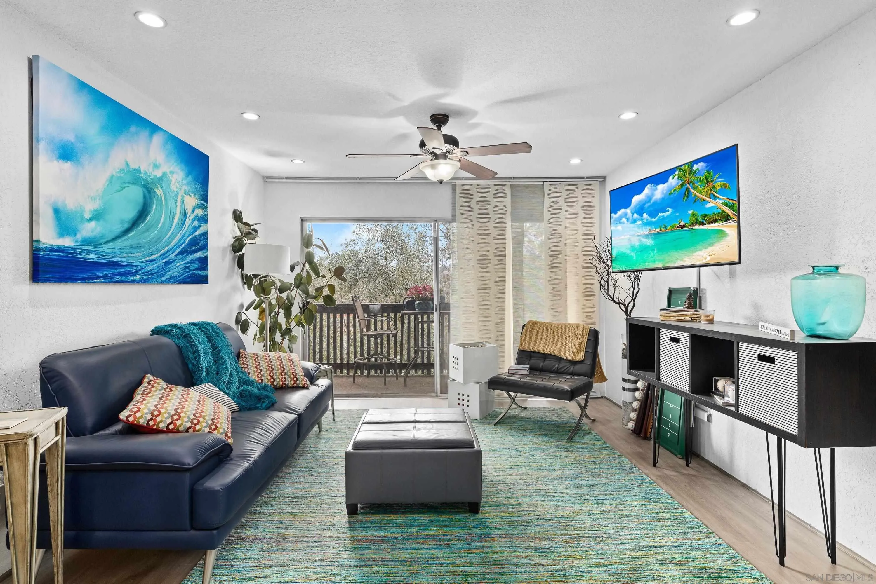 6406 Friars Road, Unit 338 San Diego, CA 92108 - Photo 11 of 36 a living room with furniture and a flat screen tv