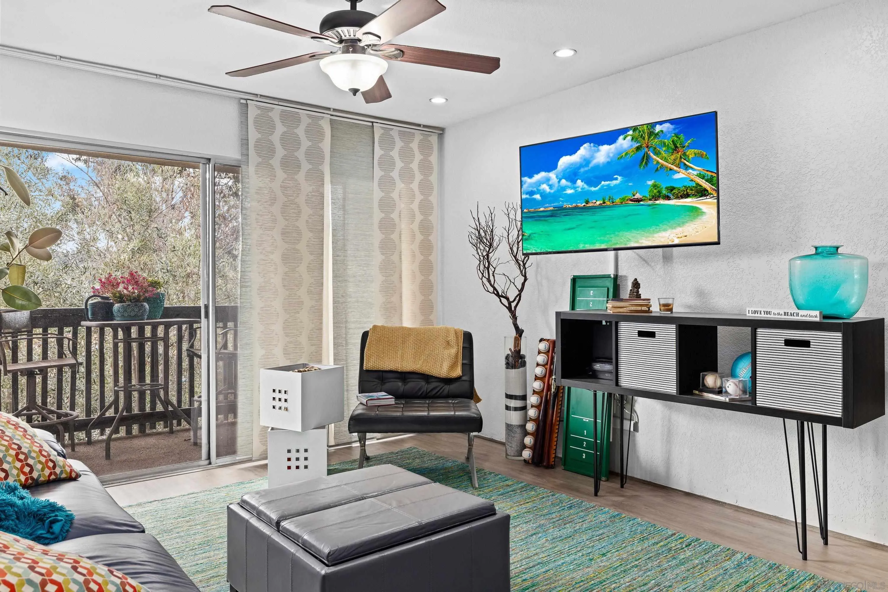 6406 Friars Road, Unit 338 San Diego, CA 92108 - Photo 12 of 36 a living room with furniture and a flat screen tv
