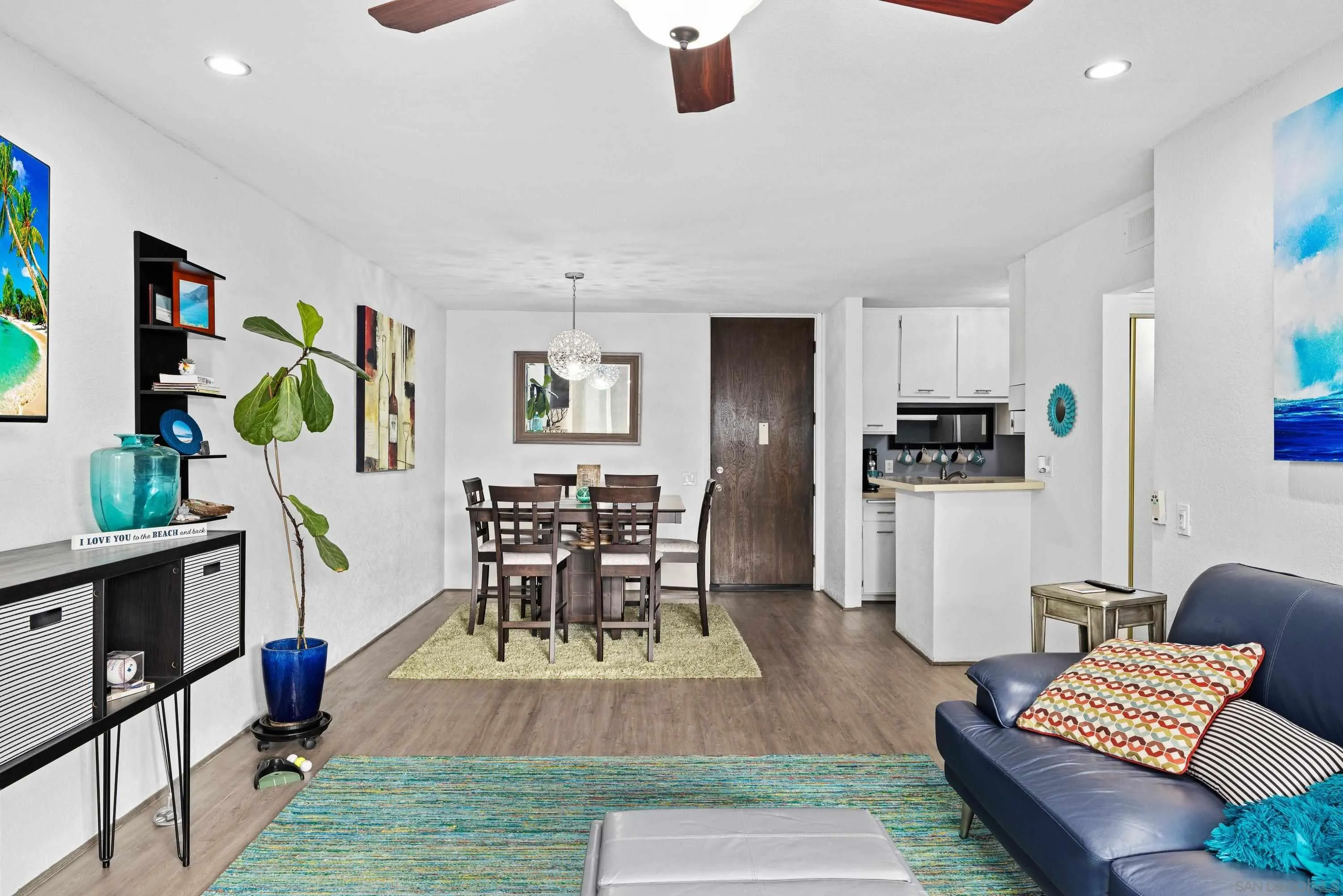 6406 Friars Road, Unit 338 San Diego, CA 92108 - Photo 13 of 36 a living room with furniture and wooden floor