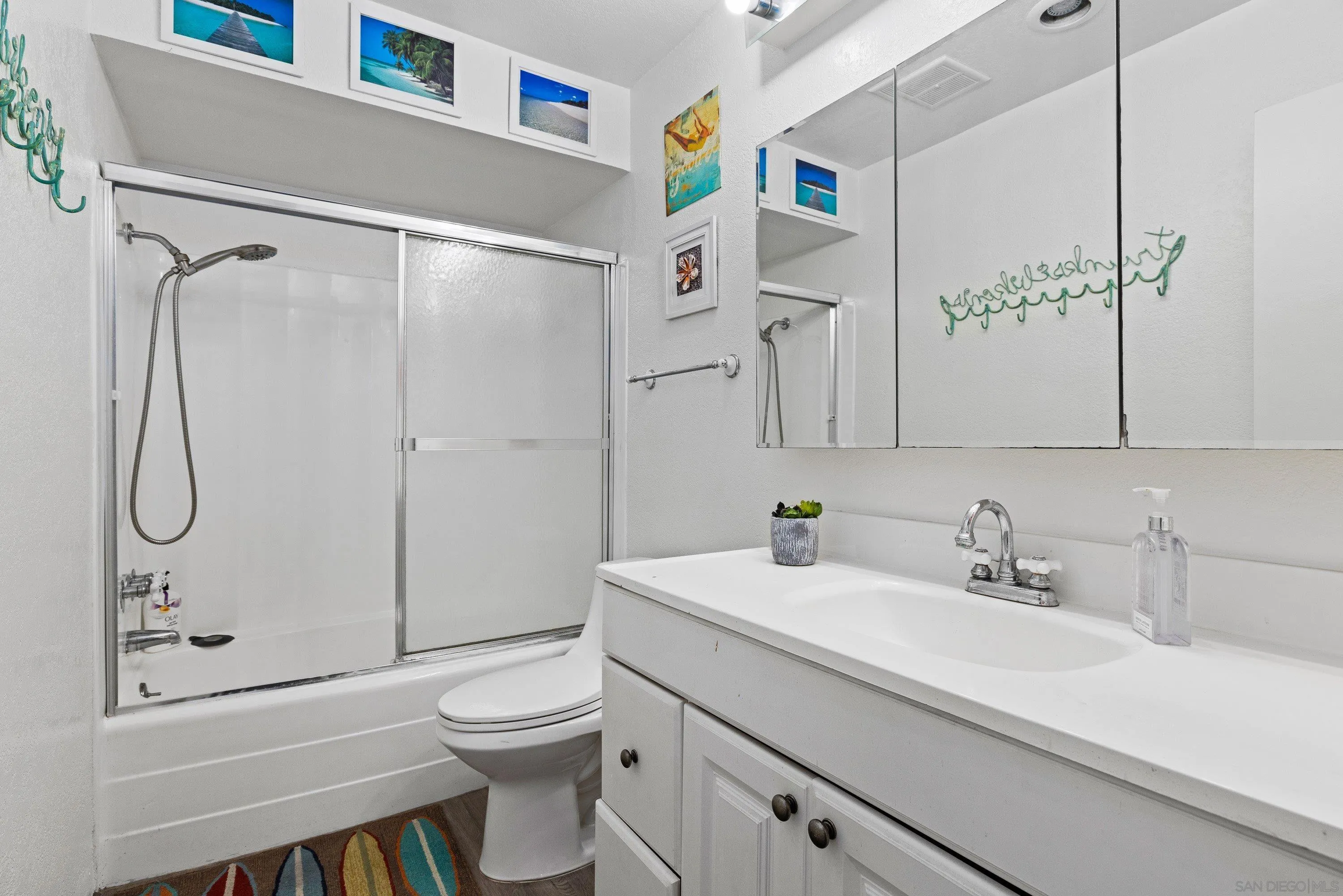 6406 Friars Road, Unit 338 San Diego, CA 92108 - Photo 18 of 36 a bathroom with a sink a toilet and shower