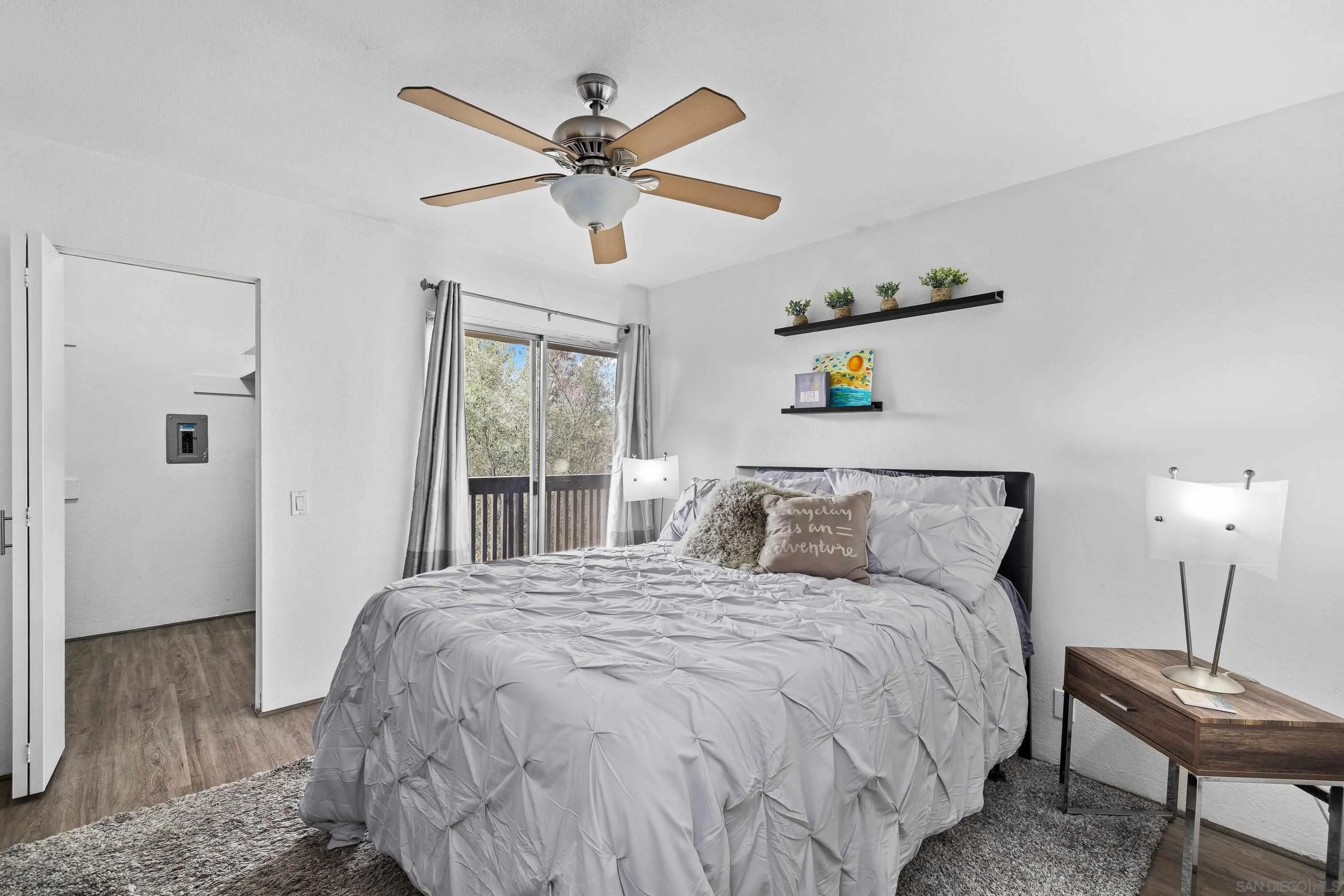 6406 Friars Road, Unit 338 San Diego, CA 92108 - Photo 19 of 36 a bedroom with a large bed and a window