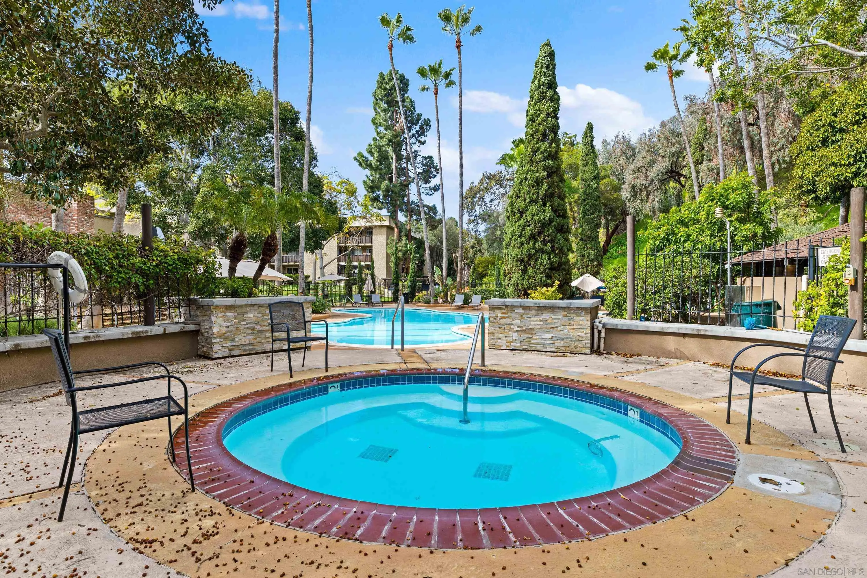 6406 Friars Road, Unit 338 San Diego, CA 92108 - Photo 28 of 36 a view of a swimming pool with a patio
