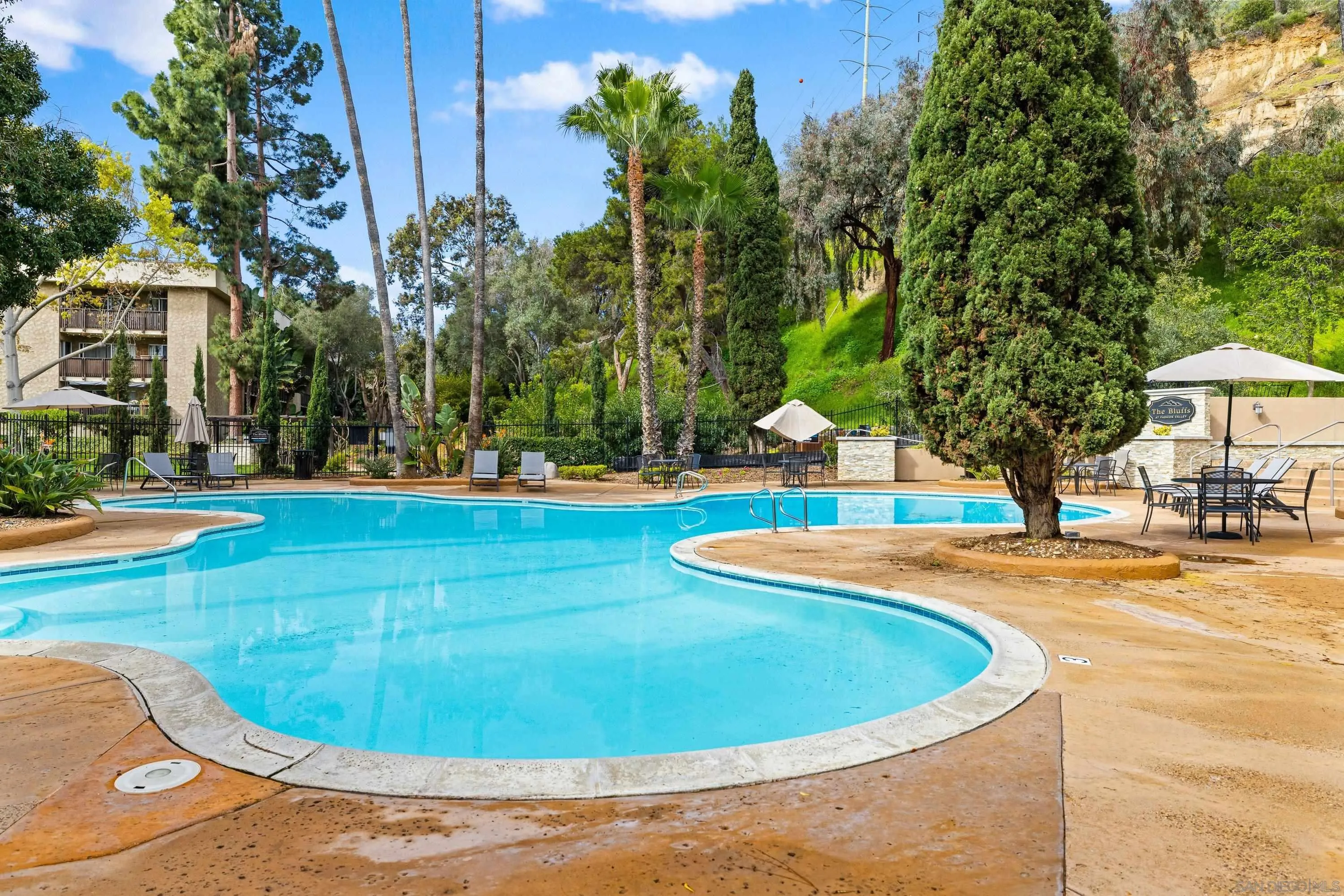 6406 Friars Road, Unit 338 San Diego, CA 92108 - Photo 29 of 36 a view of a swimming pool with a yard