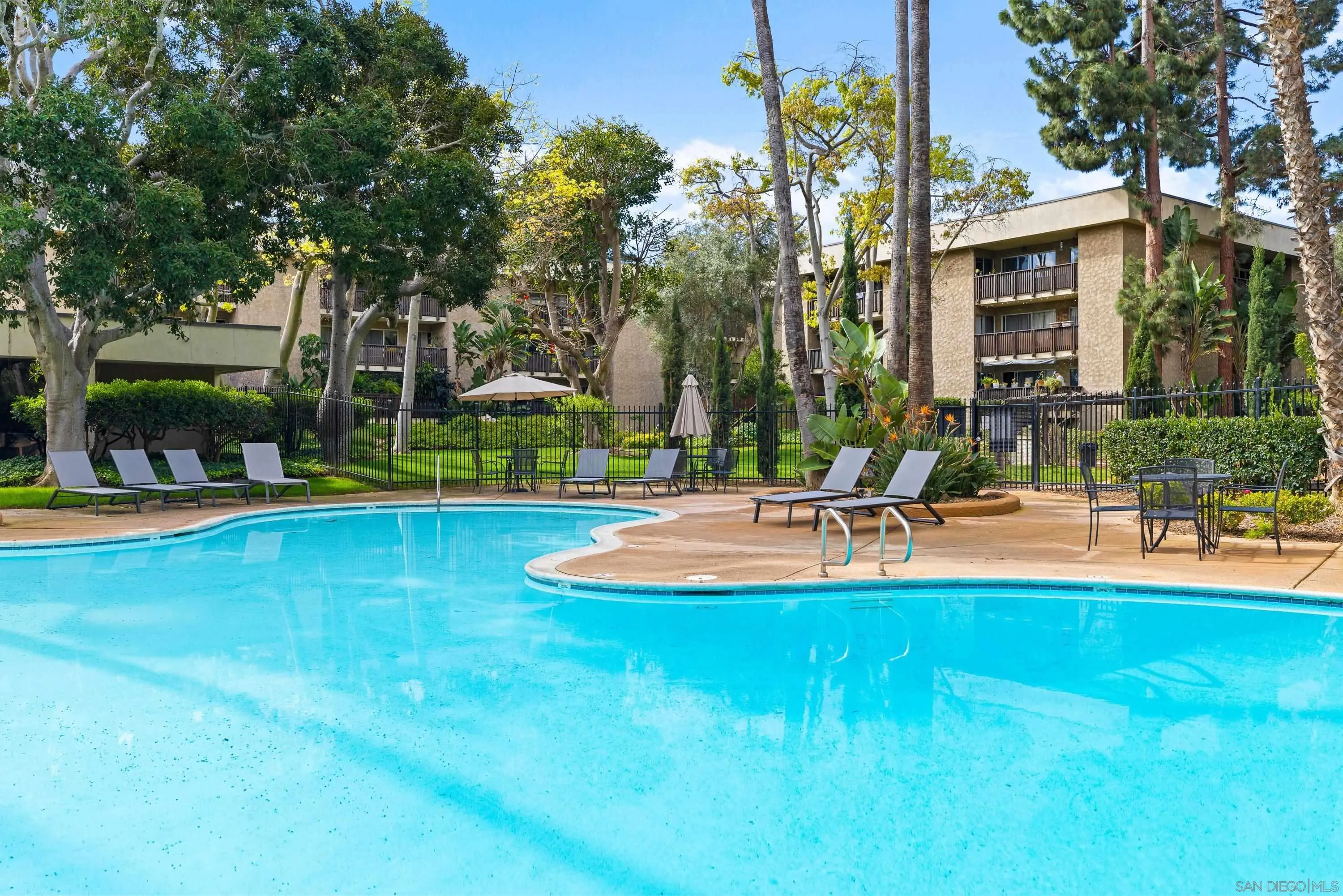 6406 Friars Road, Unit 338 San Diego, CA 92108 - Photo 30 of 36 a view of a swimming pool with an outdoor space and seating area