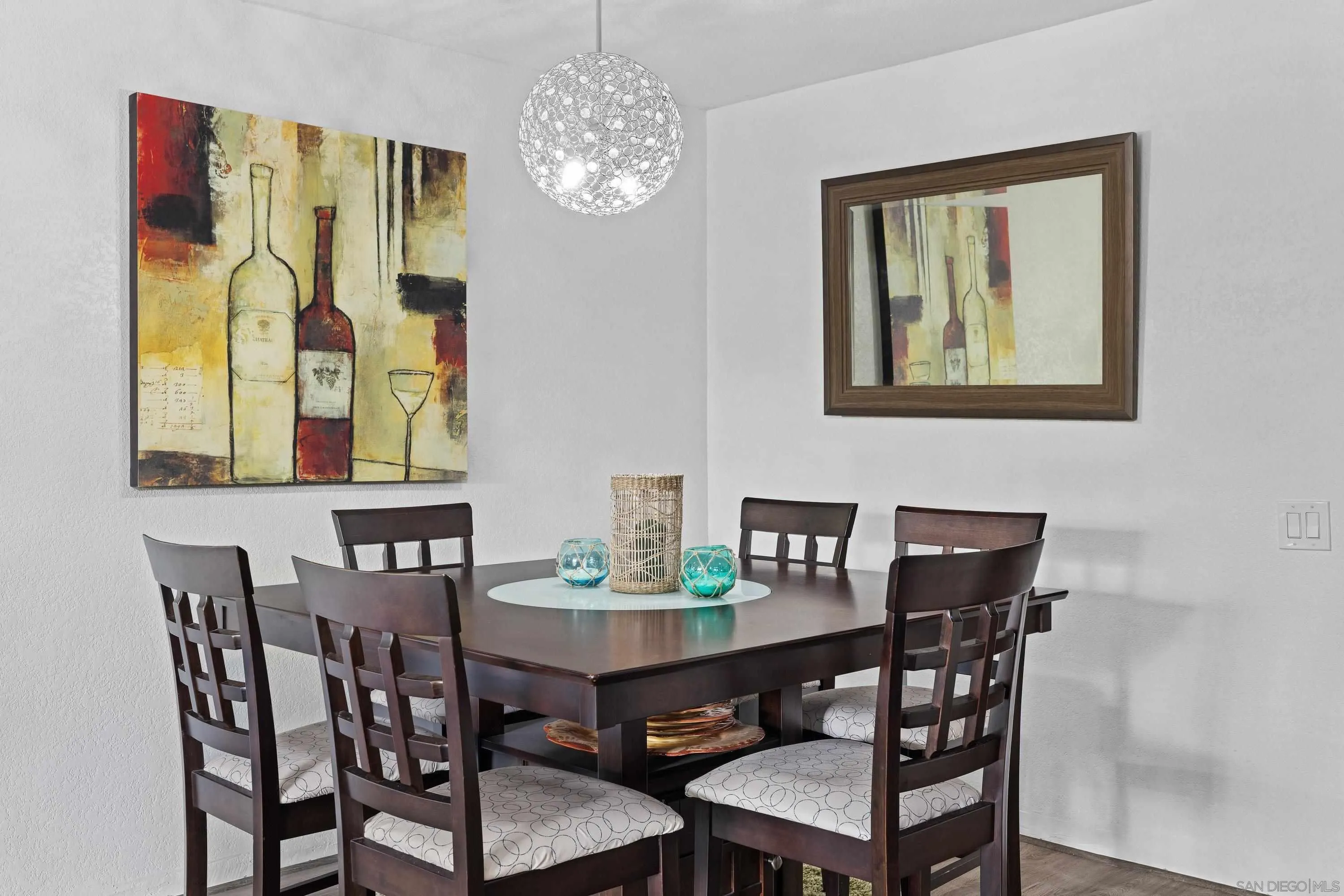 6406 Friars Road, Unit 338 San Diego, CA 92108 - Photo 4 of 36 a view of a dining room with furniture and chandelier