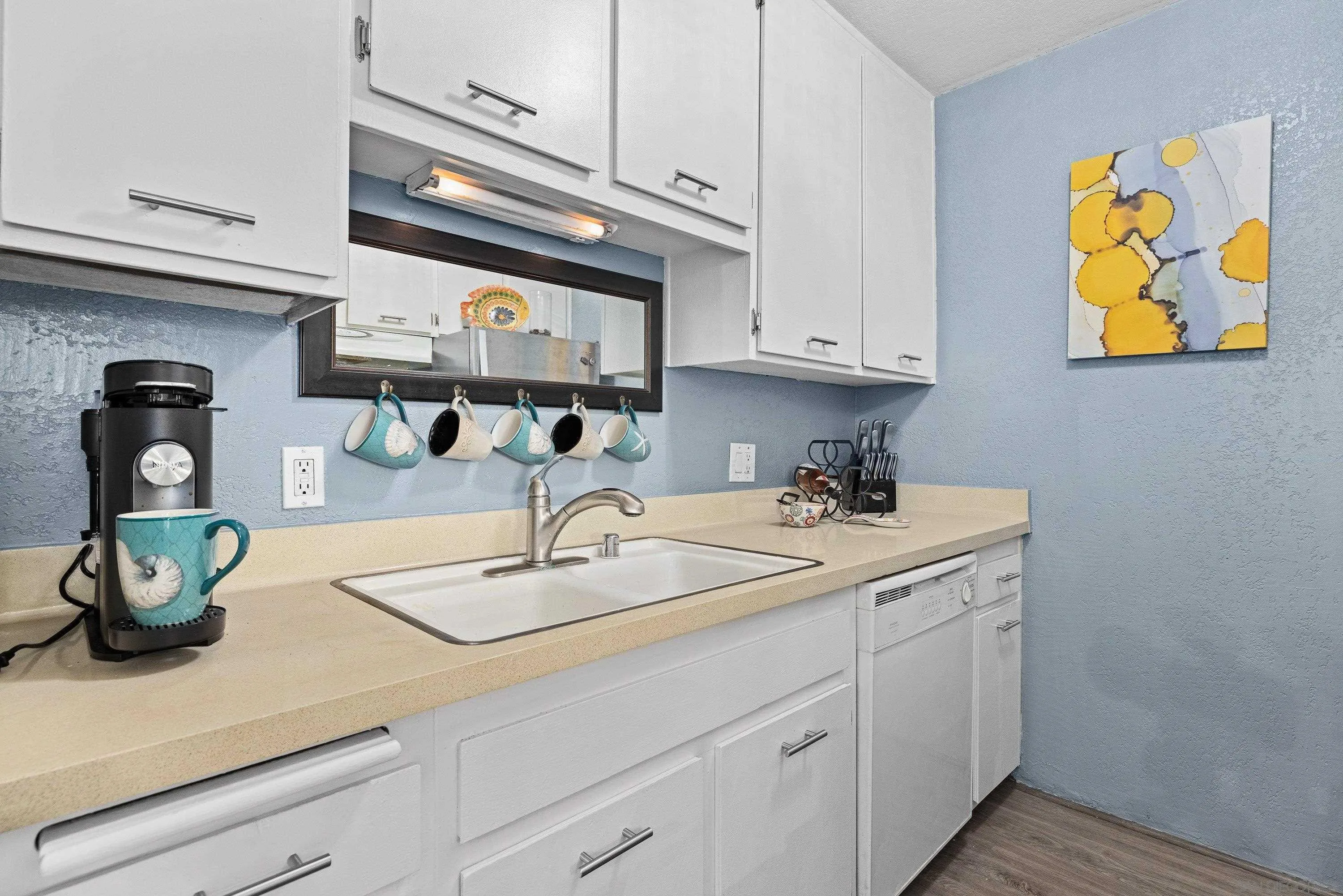 6406 Friars Road, Unit 338 San Diego, CA 92108 - Photo 8 of 36 a kitchen with stainless steel appliances granite countertop a sink a stove and cabinets
