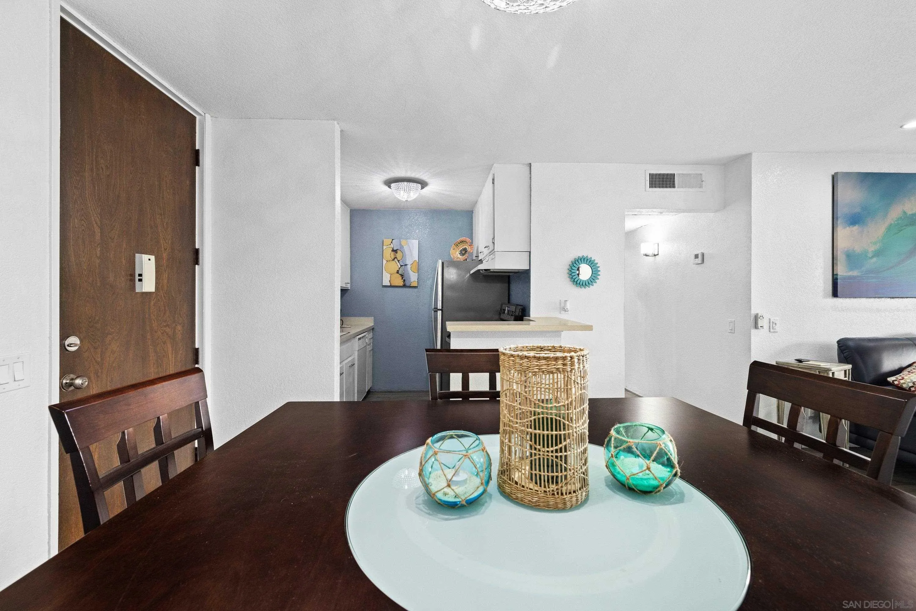 6406 Friars Road, Unit 338 San Diego, CA 92108 - Photo 10 of 36 a living room with furniture and a table