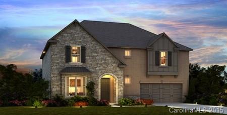 1385 Cilantro Court, Unit 306 Tega Cay, SC 29708 - Photo 1 of 10 a front view of a house with a garden