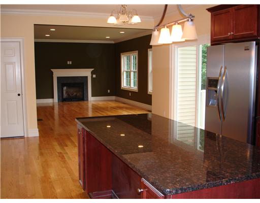 690 Middle Road East Greenwich, RI 02818 - Photo 5 of 12 Exterior Front. Open space from kitchen to familyroom.hardwood floors,crown moldings,central air,sloiders from kitchen to deck.