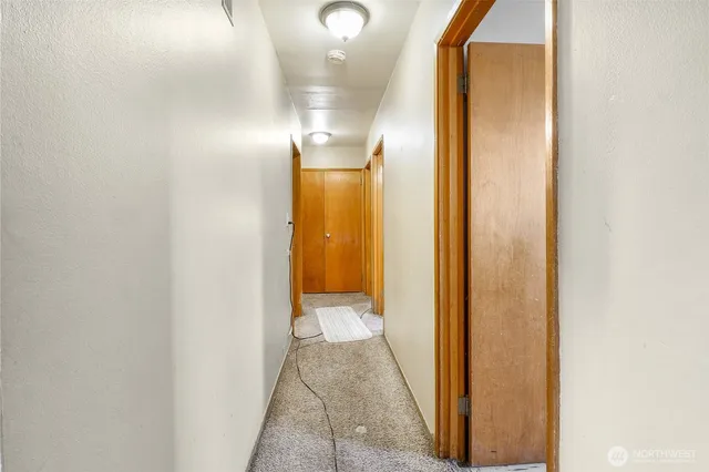 a view of a bathroom from a hallway