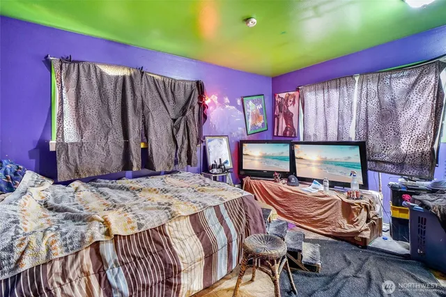 a bedroom with a bed and a closet