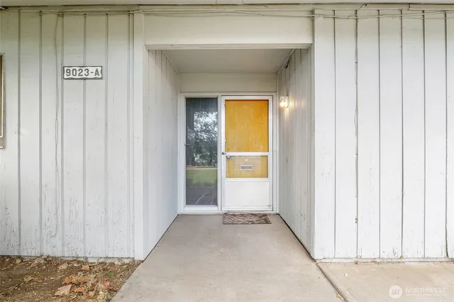 a view of a closet area with en suite bathroom