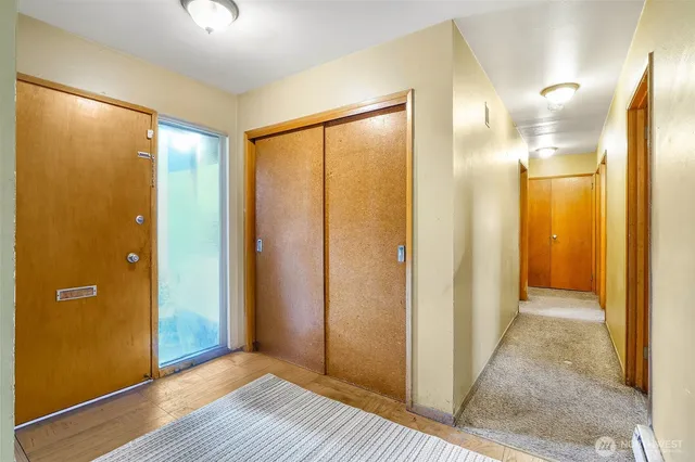 a view of a bathroom with wooden floor
