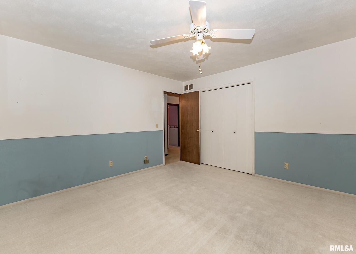 2705 36th Street Rock Island, IL 61201 - Photo 17 of 29 an empty room and chandelier fan