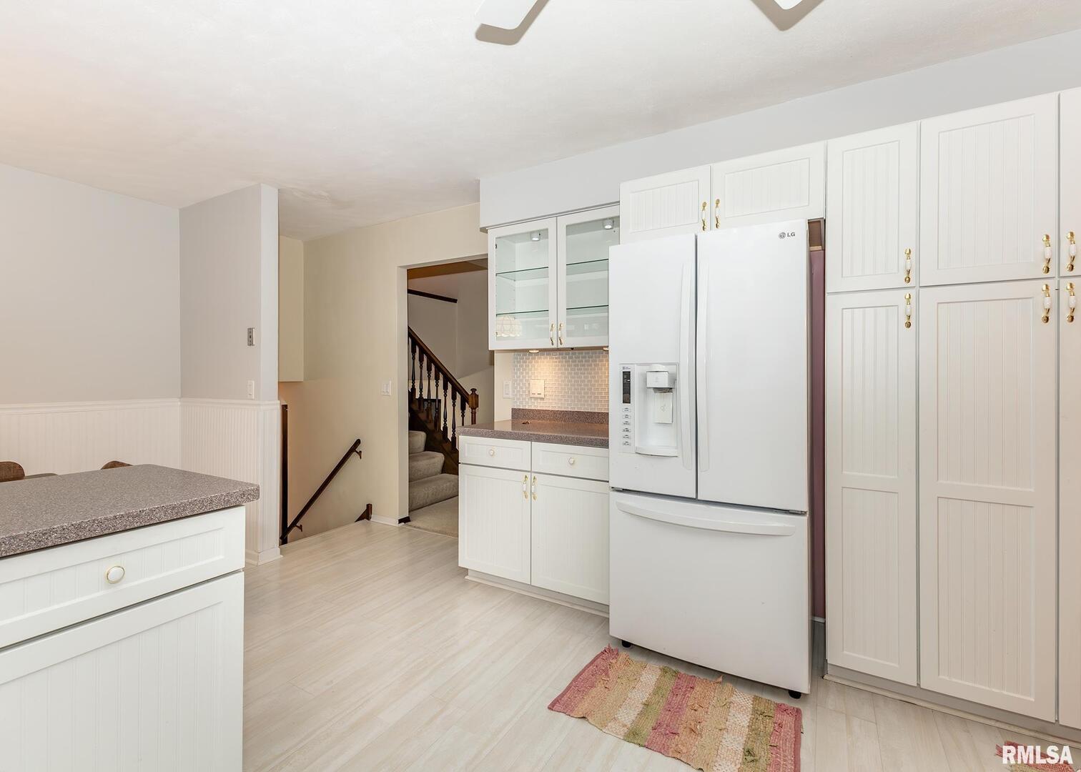 2705 36th Street Rock Island, IL 61201 - Photo 6 of 29 a kitchen with a refrigerator and a stove top oven