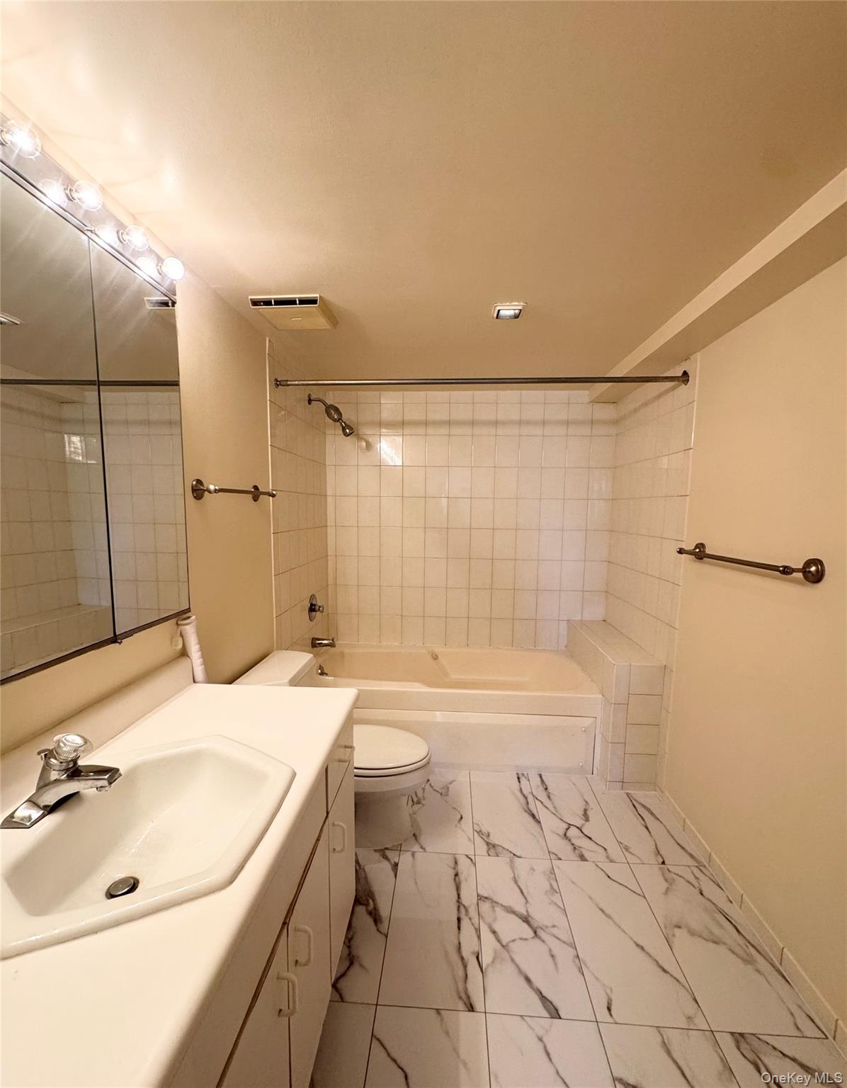 170 Schofield Street, Unit 2F Bronx, NY 10464 - Photo 11 of 11 a bathroom with a sink and a mirror