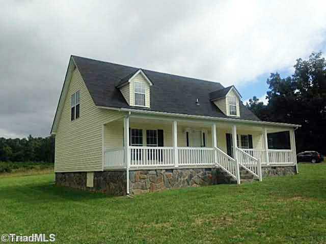 1957 Stockyard Road Staley, NC 27355 - Photo 1 of 14 Exterior Front. Home has new roof.. full front porch, front door just repainted