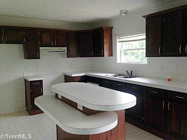 1957 Stockyard Road Staley, NC 27355 - Photo 3 of 14 Kitchen. kitchen has center island and large pantry