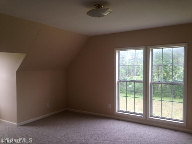 1957 Stockyard Road Staley, NC 27355 - Photo 7 of 14 2nd Bedroom. 2nd bedroom upstairs, berber carpet and paint looks good...