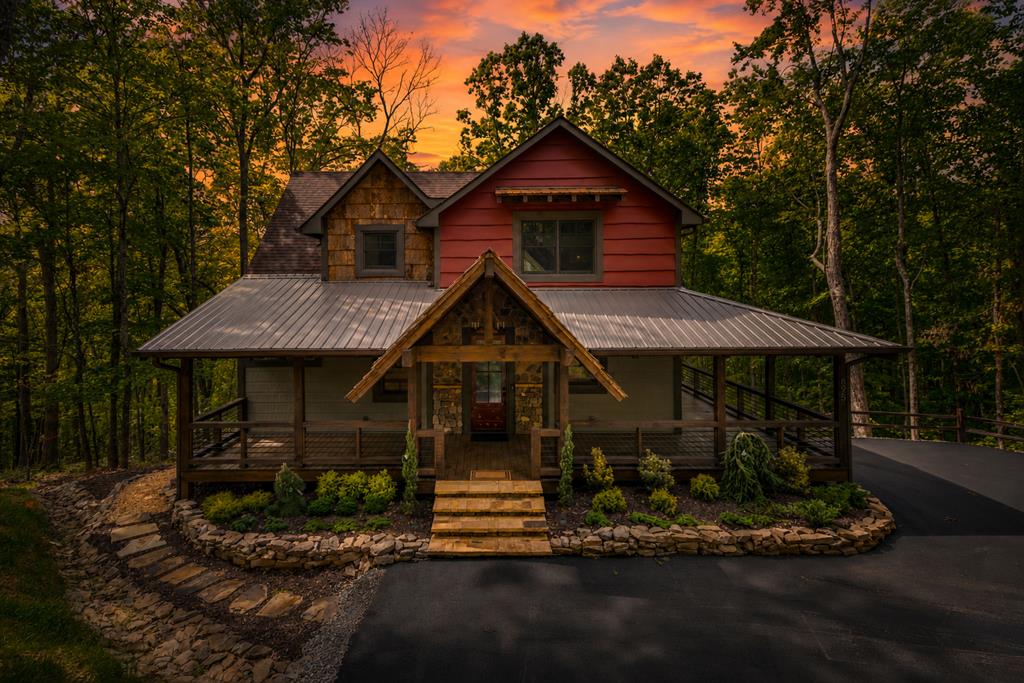 895 Price Road Blue Ridge, GA 30513 - Photo 2 of 140 a front view of a house with garden