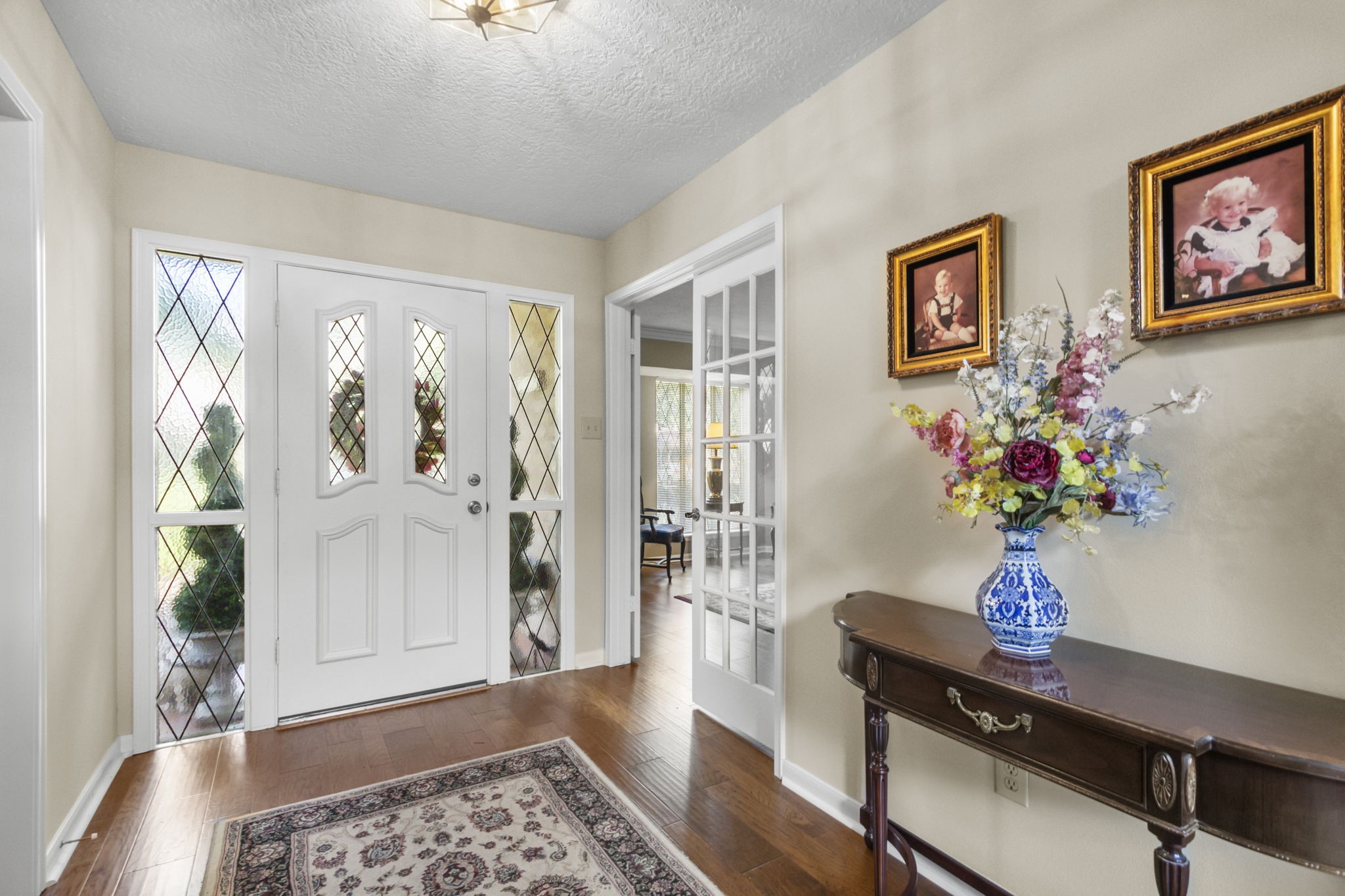 17710 Treeloch Lane Spring, TX 77379 - Photo 12 of 45 a view of a livingroom with wooden floor and a potted plant