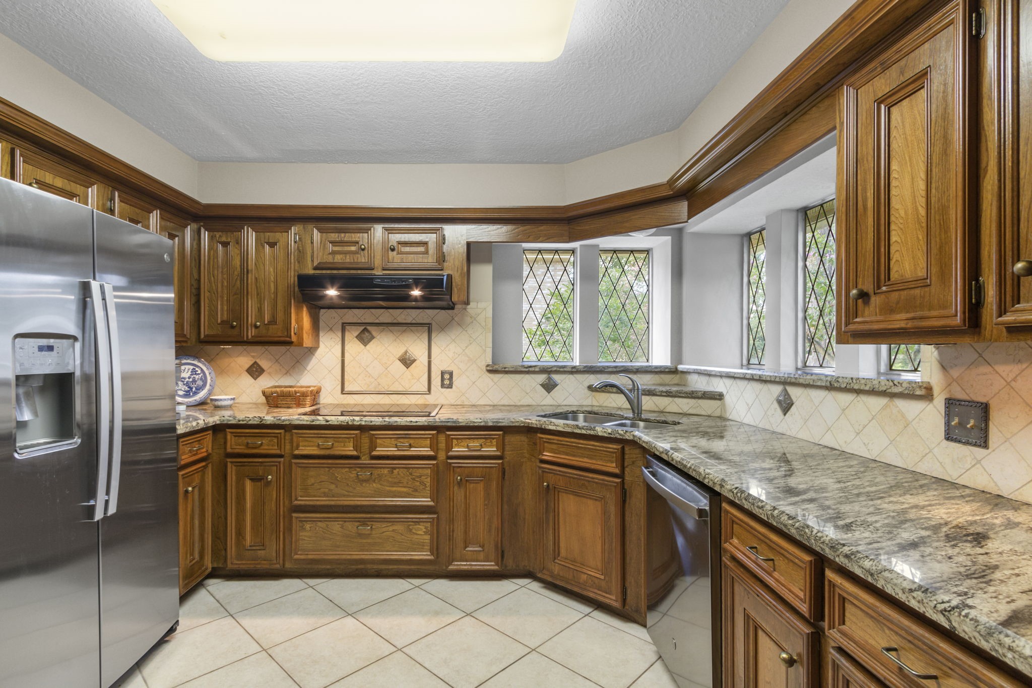 17710 Treeloch Lane Spring, TX 77379 - Photo 17 of 45 a kitchen with a sink stove and cabinets