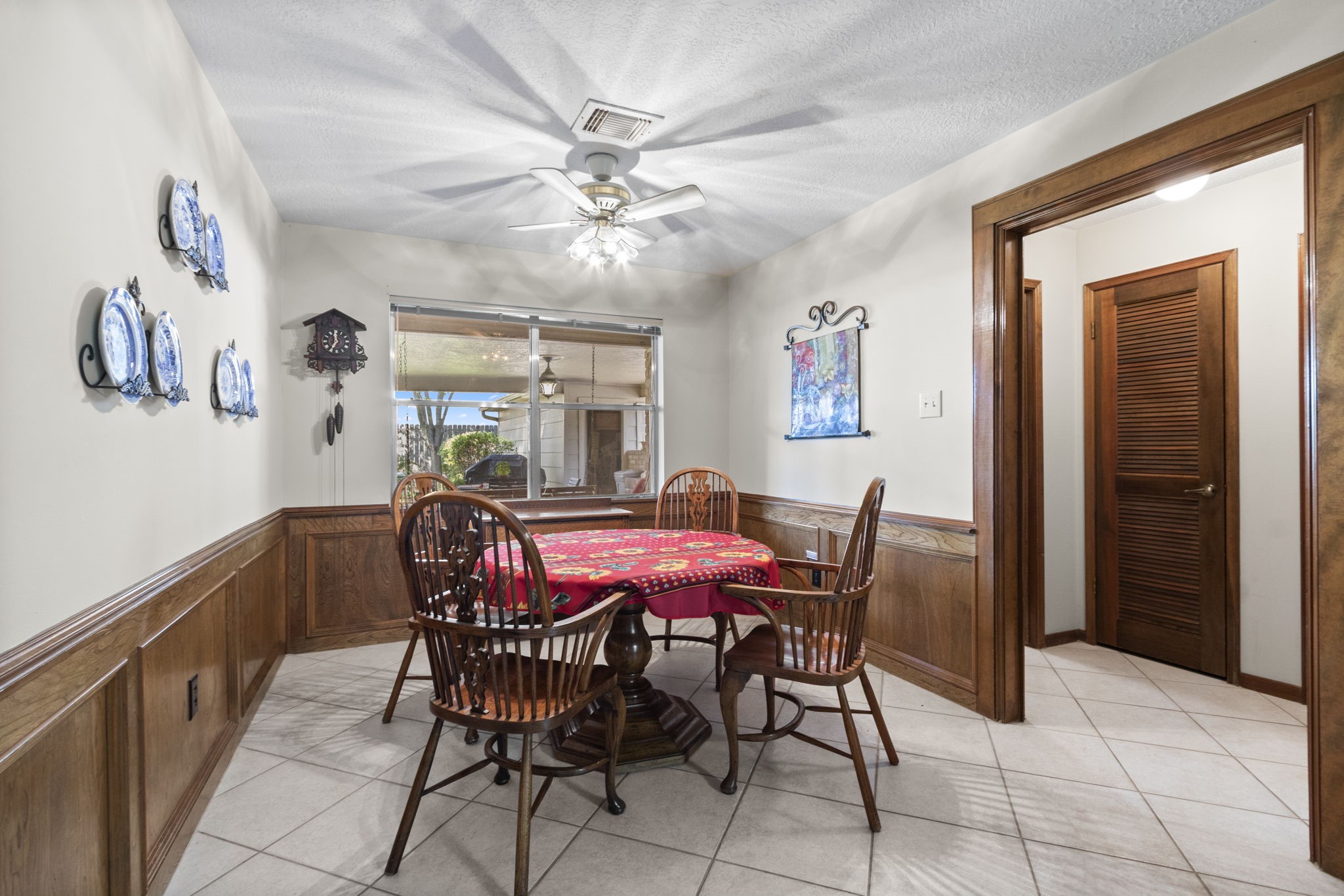 17710 Treeloch Lane Spring, TX 77379 - Photo 19 of 45 a view of a dining room with furniture and a chandelier fan