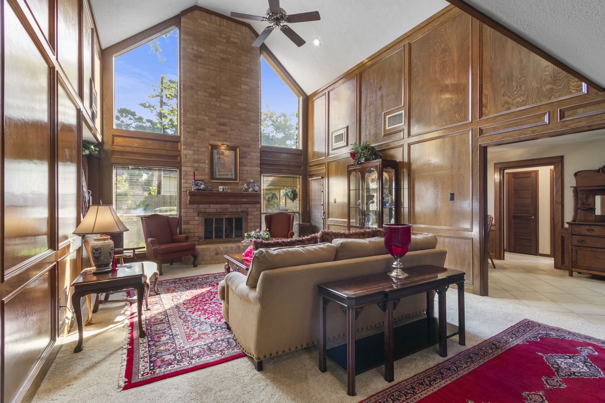 17710 Treeloch Lane Spring, TX 77379 - Photo 2 of 45 a living room with furniture a fireplace and rug floor