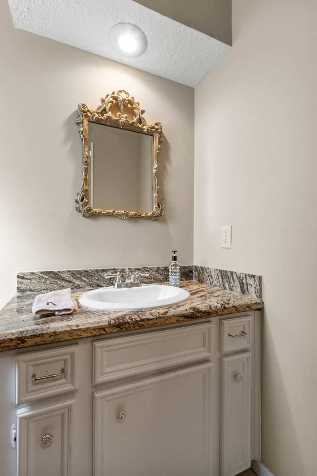 17710 Treeloch Lane Spring, TX 77379 - Photo 22 of 45 a bathroom with a granite countertop sink and a mirror