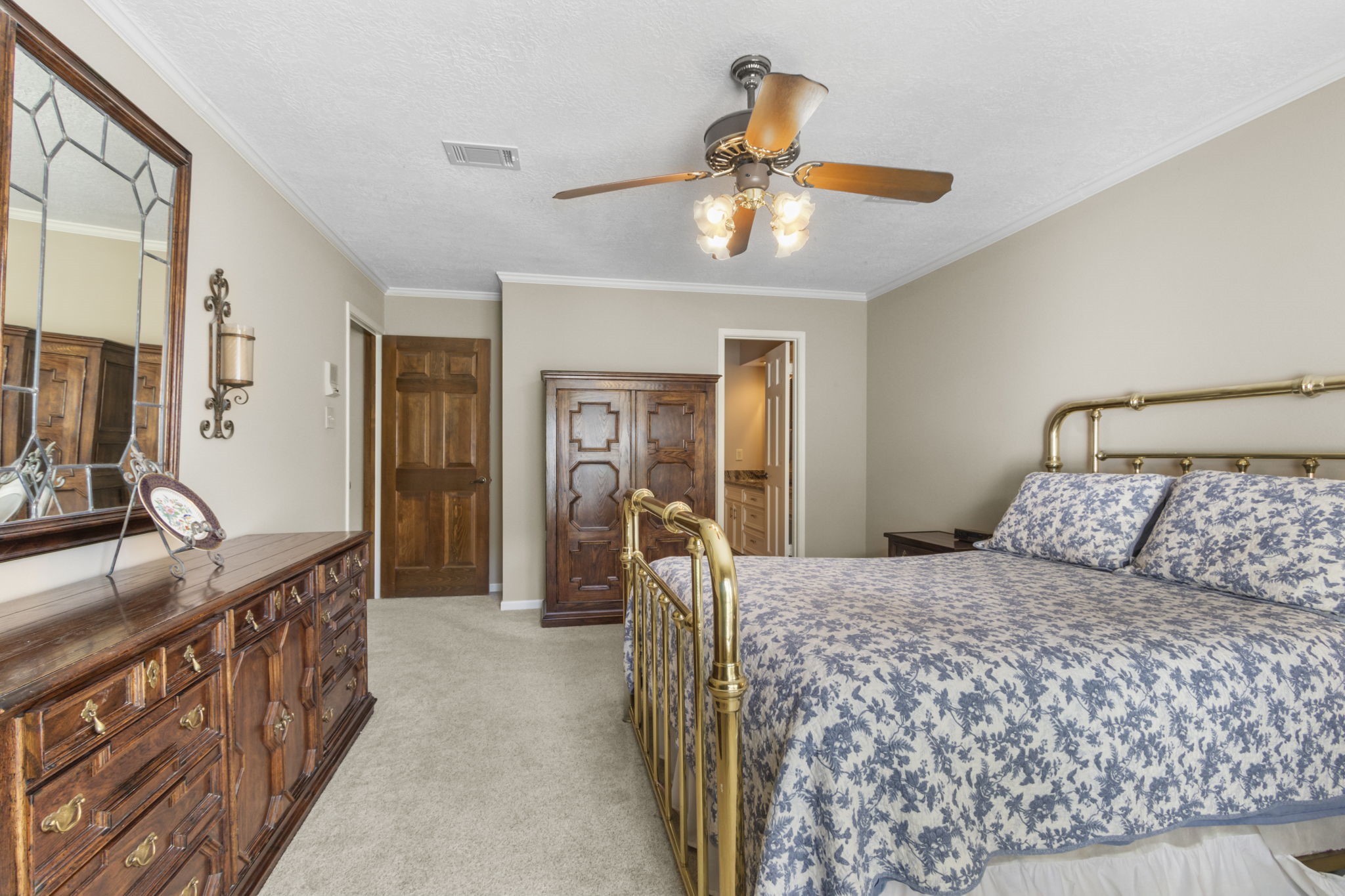 17710 Treeloch Lane Spring, TX 77379 - Photo 24 of 45 a bedroom with a bed and ceiling fan