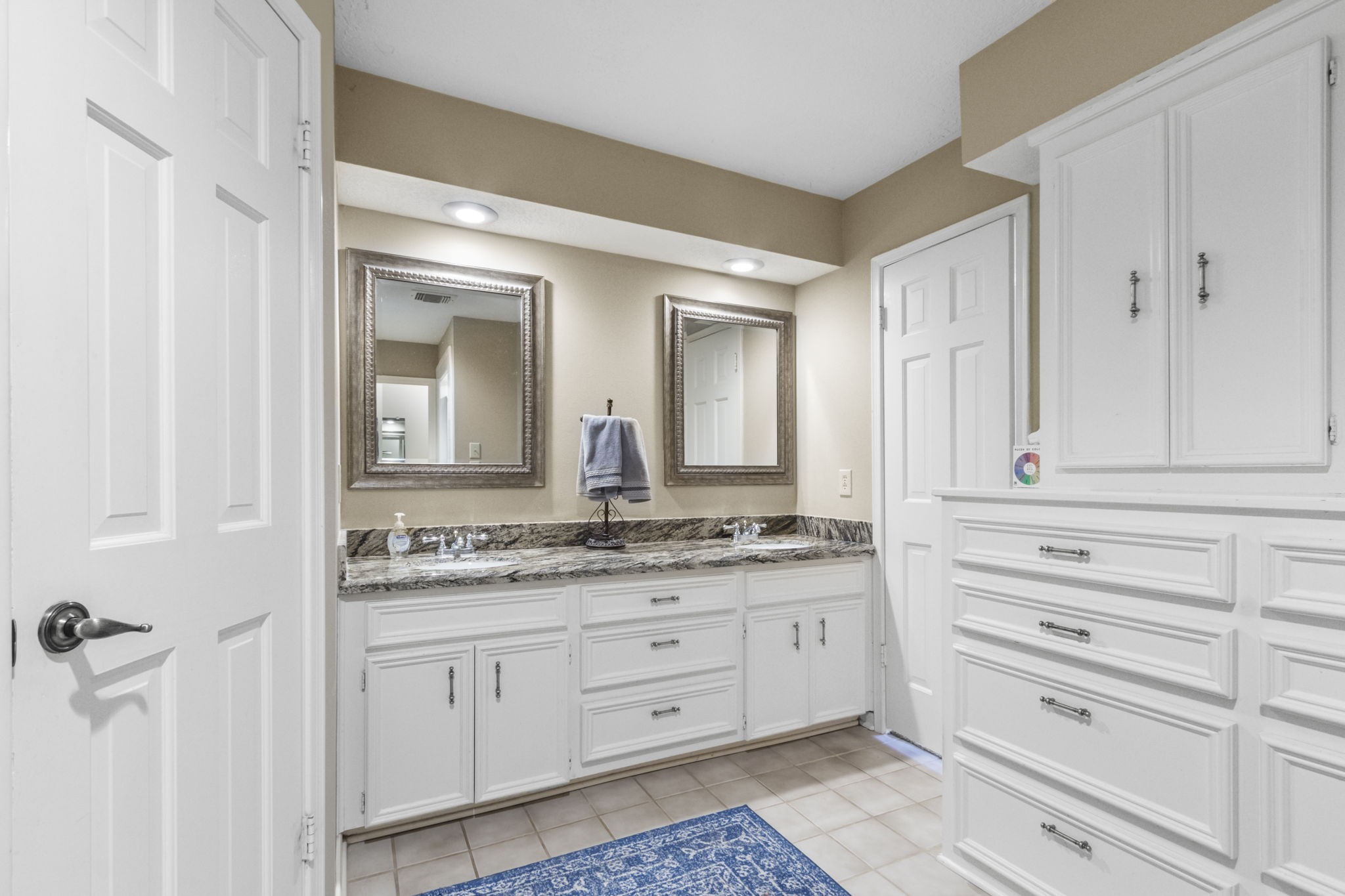 17710 Treeloch Lane Spring, TX 77379 - Photo 25 of 45 a bathroom with a granite countertop sink mirror and