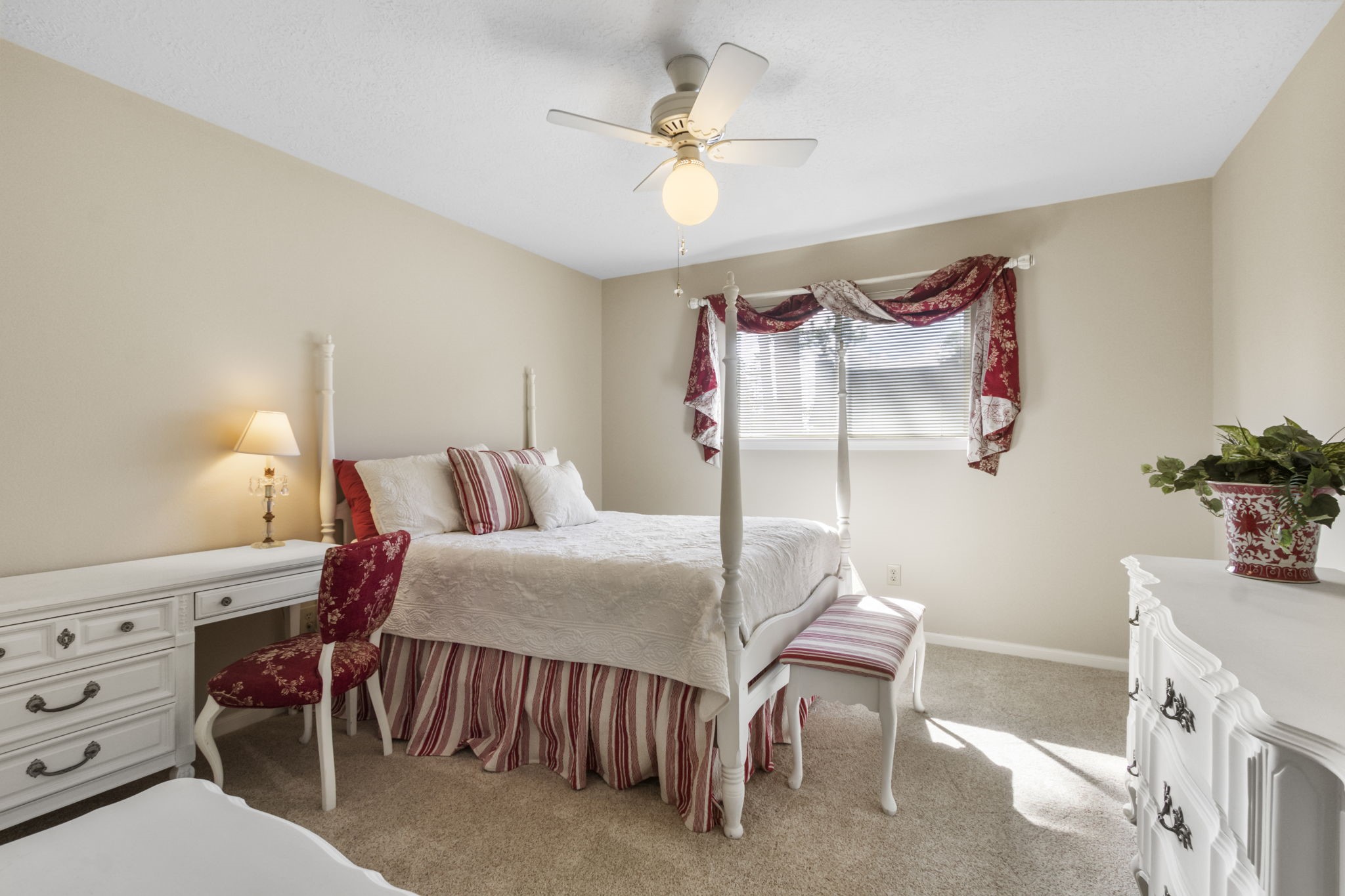 17710 Treeloch Lane Spring, TX 77379 - Photo 36 of 45 a bedroom with a bed and a chandelier